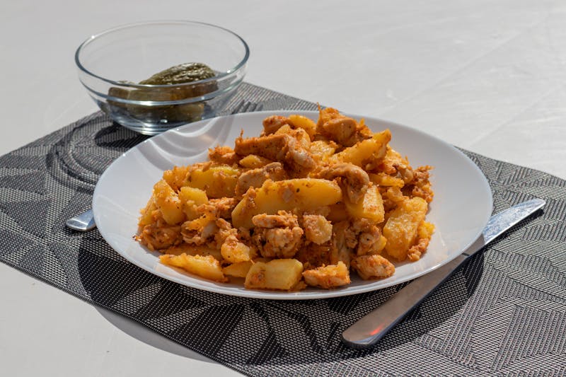Nashville Hot boneless wings with pickle garnish