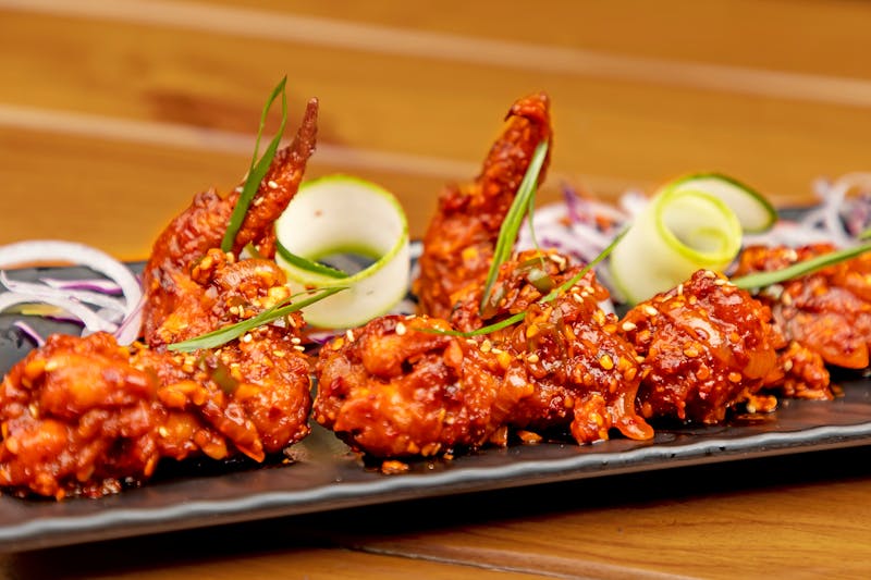 Saucy buffalo wings at Wing Snob with bold flavor
